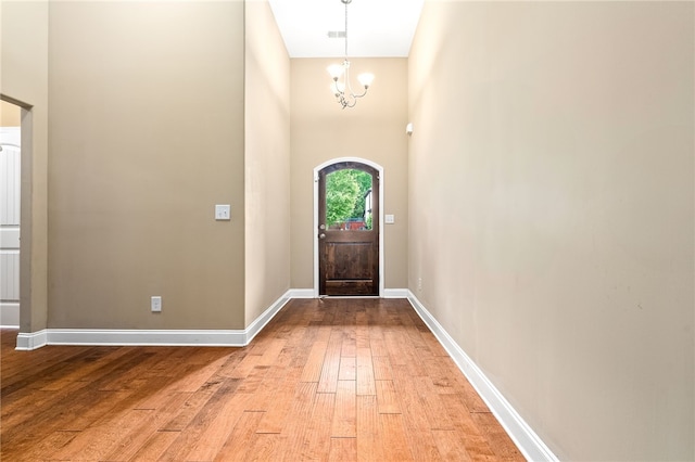 2316 Tuscany Pl, Auburn, AL 36830 - foyer entrance featuring light wood-style floors, an inviting chandelier, a towering ceiling, baseboards, and visible vents