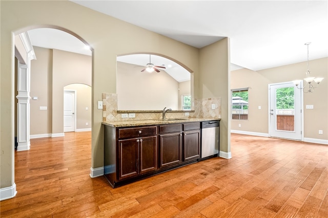 2316 Tuscany Pl, Auburn, AL 36830 - kitchen featuring tasteful backsplash, dishwasher, arched walkways, dark brown cabinetry, and light wood finished floors