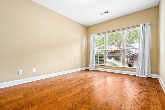2316 Tuscany Pl, Auburn, AL 36830 - empty room with baseboards, wood finished floors, and visible vents