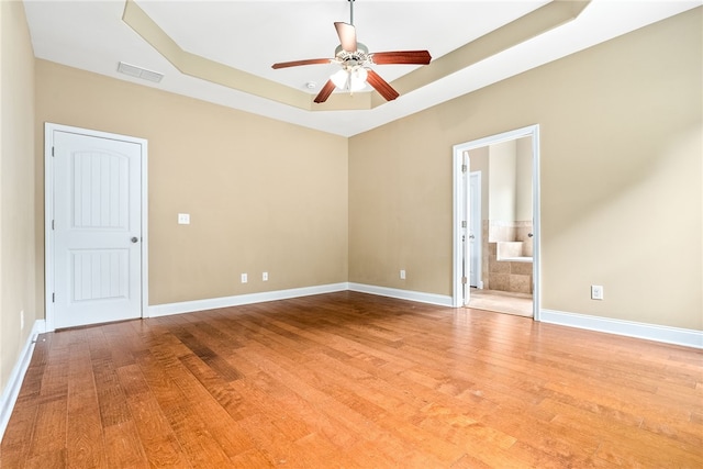 2316 Tuscany Pl, Auburn, AL 36830 - empty room with a raised ceiling, light wood-style flooring, visible vents, and ceiling fan