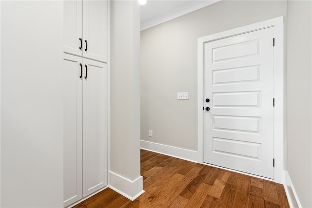 interior space featuring wood finished floors and baseboards