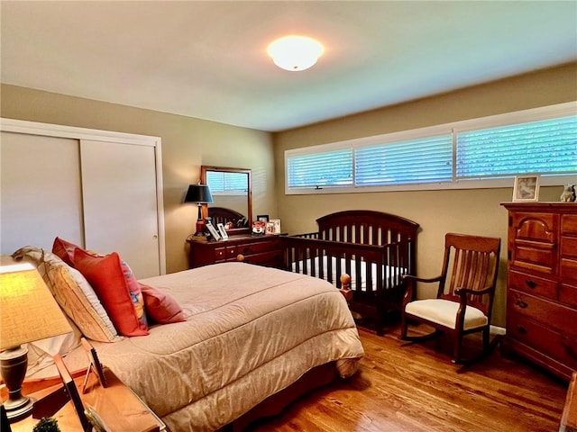 bedroom with a closet and wood finished floors