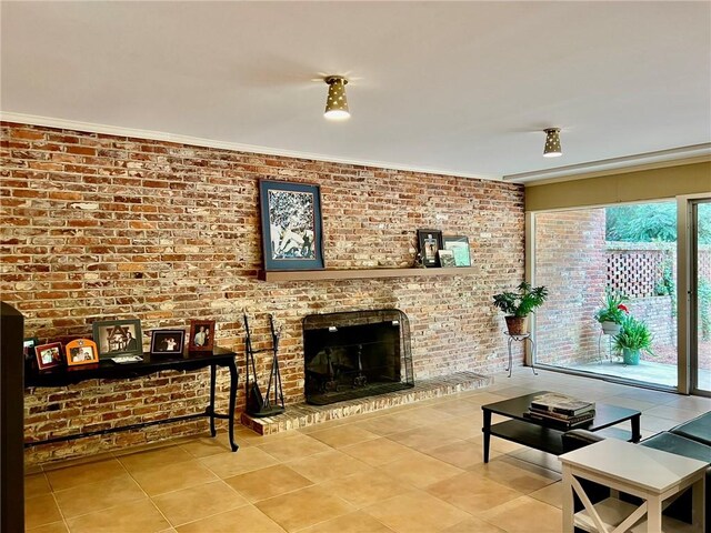 tiled living room featuring ornamental molding, brick wall, and a fireplace