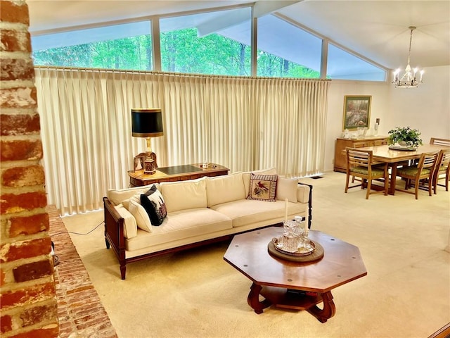 living area featuring vaulted ceiling, a chandelier, and carpet