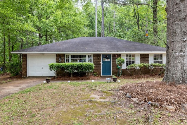 ranch-style house featuring concrete driveway, brick siding, and a garage