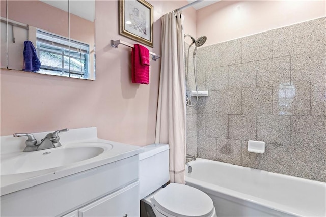 full bath with shower / bath combo with shower curtain, toilet, and vanity