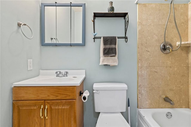bathroom featuring toilet, shower / washtub combination, and vanity