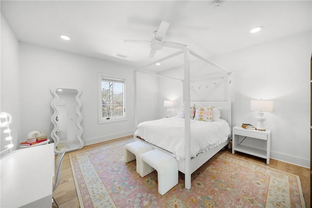 bedroom with ceiling fan, baseboards, wood finished floors, and recessed lighting