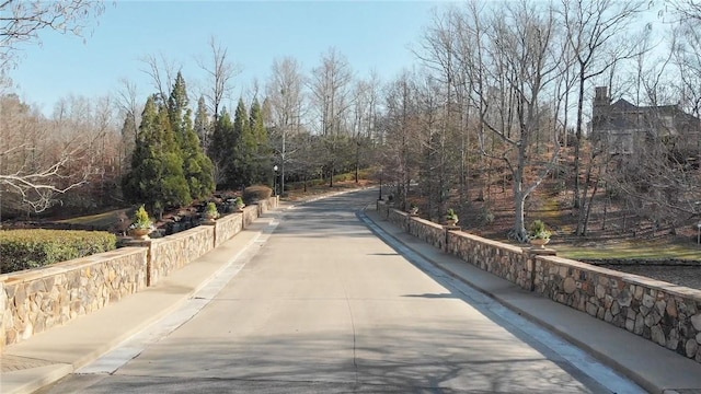 view of road with curbs and sidewalks