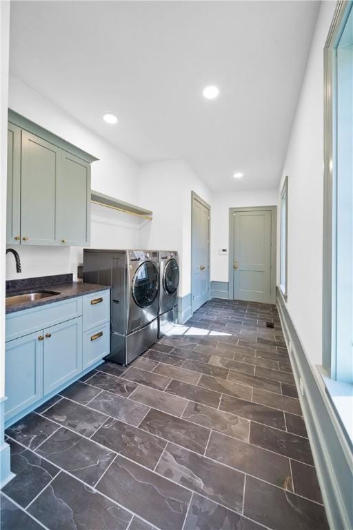 laundry room with independent washer and dryer, a sink, cabinet space, and recessed lighting