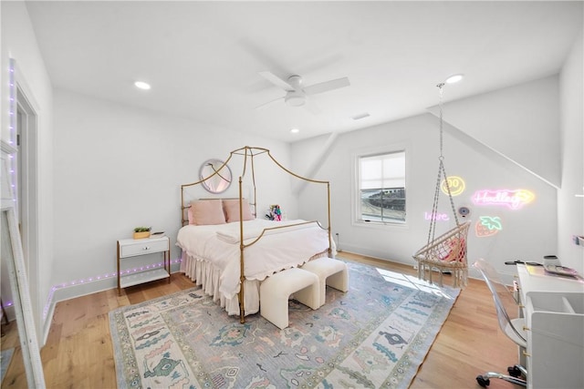 bedroom with recessed lighting, baseboards, and wood finished floors