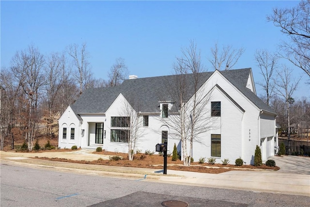 view of front of home featuring concrete driveway