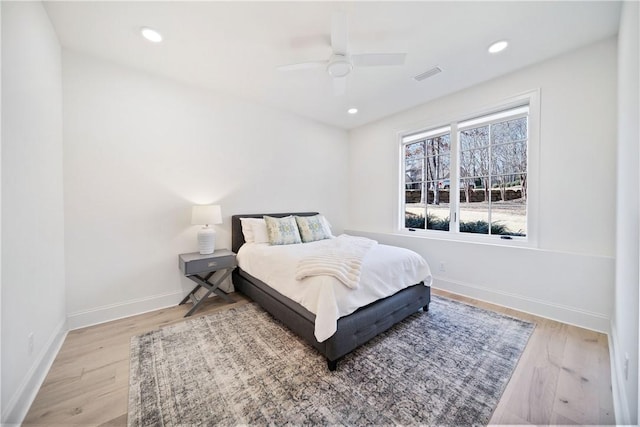 bedroom featuring baseboards, visible vents, ceiling fan, wood finished floors, and recessed lighting