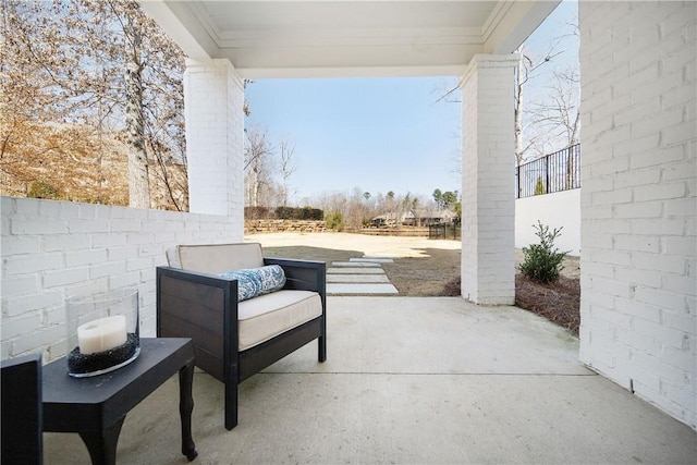 view of patio / terrace featuring fence