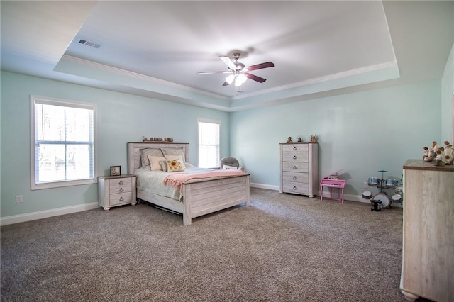 bedroom featuring a raised ceiling, ceiling fan, and carpet