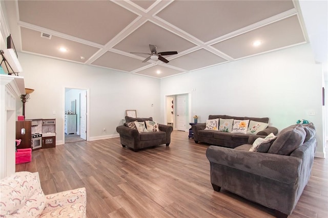 living room with ceiling fan, hardwood / wood-style floors, a fireplace, and coffered ceiling