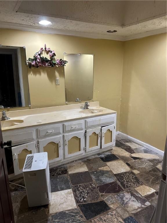 bathroom featuring crown molding and vanity