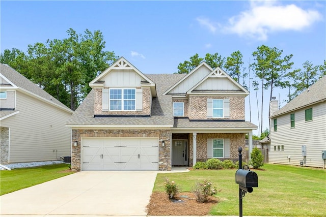 craftsman inspired home featuring a front lawn, central AC unit, and a garage