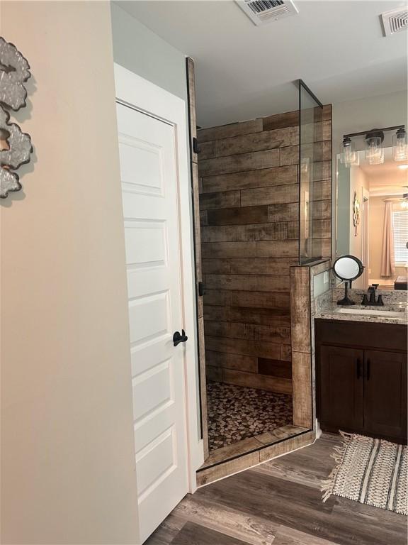 301 Lee Road 994, Cusseta, AL 36852 - full bath with vanity, a walk in shower, wood finished floors, and visible vents