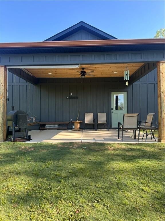 301 Lee Road 994, Cusseta, AL 36852 - back of house featuring board and batten siding, a patio, and a lawn
