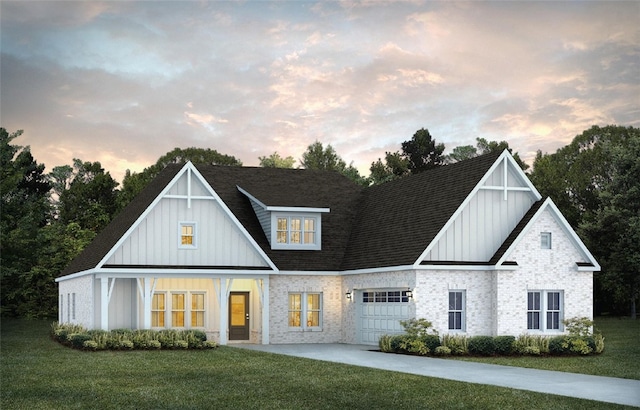 view of front of property featuring a garage, a shingled roof, board and batten siding, a front yard, and driveway