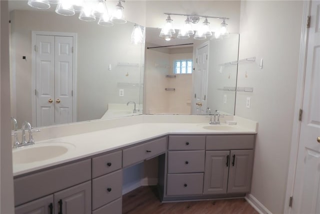 106 Pine Ridge Ln, Tallassee, AL 36078 - bathroom with double vanity, wood finished floors, and a closet