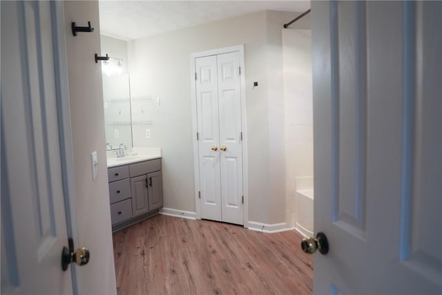 106 Pine Ridge Ln, Tallassee, AL 36078 - full bath featuring vanity, wood finished floors, a closet, and washtub / shower combination