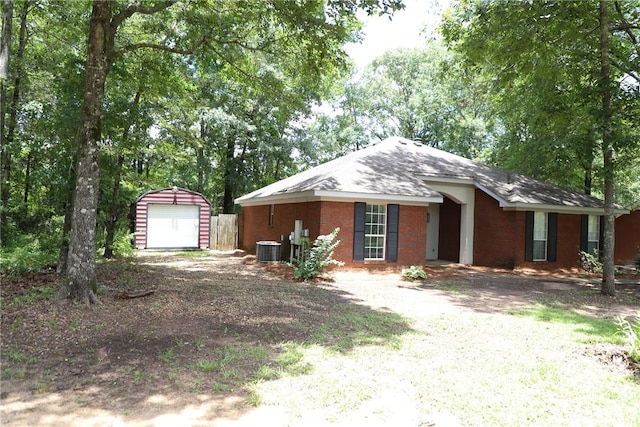 106 Pine Ridge Ln, Tallassee, AL 36078 - single story home with an outbuilding, a detached garage, brick siding, and driveway