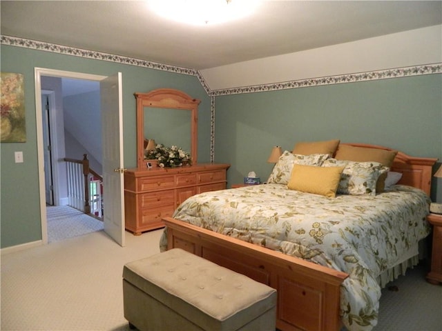 bedroom featuring carpet and lofted ceiling