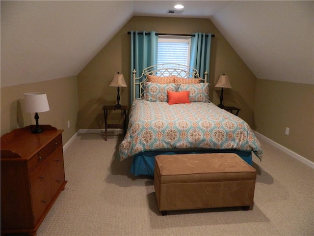 bedroom featuring lofted ceiling and carpet floors