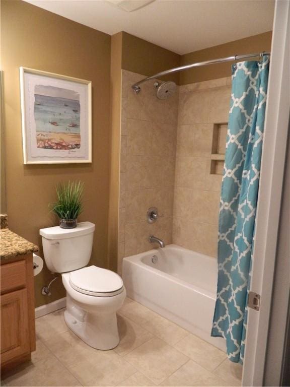 full bathroom featuring tile patterned flooring, vanity, toilet, and shower / bathtub combination with curtain