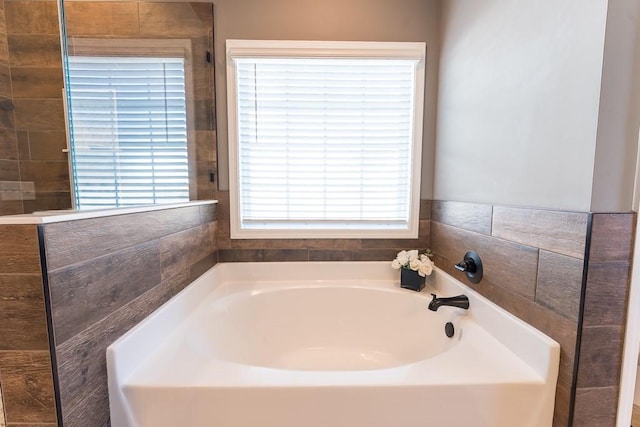 bathroom with a garden tub