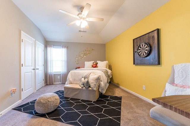 bedroom with carpet flooring, vaulted ceiling, visible vents, and baseboards