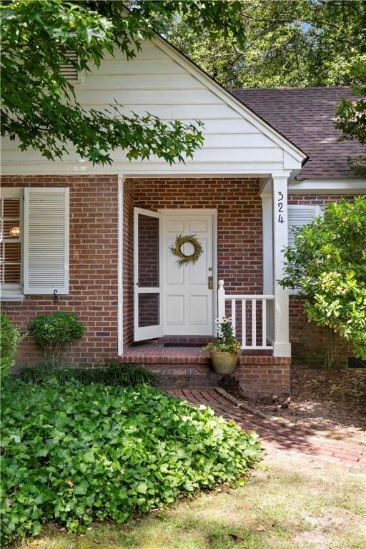 doorway to property with a porch