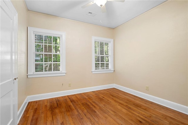 spare room featuring ceiling fan and hardwood / wood-style flooring