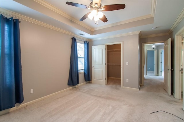 735 Hunter Ct, Auburn, AL 36832 - unfurnished bedroom with a raised ceiling, light carpet, ornamental molding, and a spacious closet