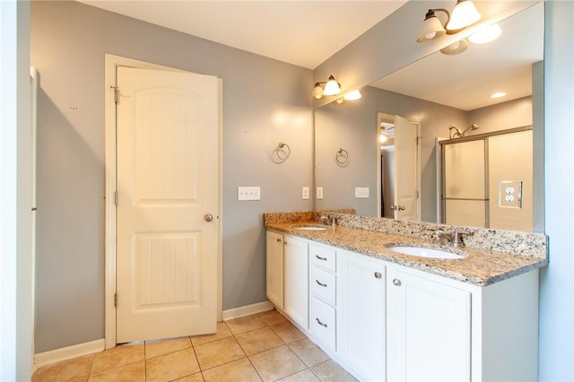 735 Hunter Ct, Auburn, AL 36832 - full bath featuring tile patterned flooring, baseboards, double vanity, and a shower with shower door