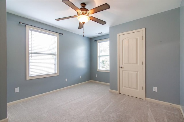 735 Hunter Ct, Auburn, AL 36832 - empty room featuring light carpet, baseboards, and ceiling fan