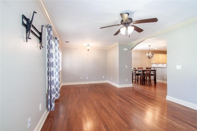 735 Hunter Ct, Auburn, AL 36832 - spare room featuring arched walkways, hardwood / wood-style flooring, a ceiling fan, crown molding, and baseboards