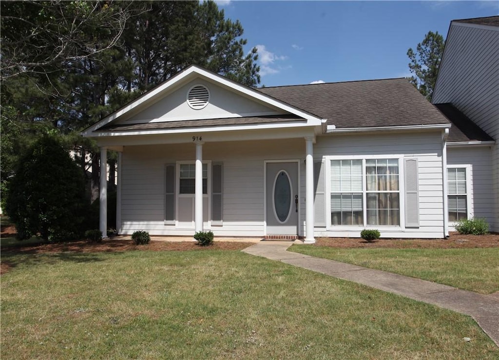 910-912-914 Harvard Pl, Auburn, AL 38630 - view of front facade with a front yard, roof with shingles, and a porch