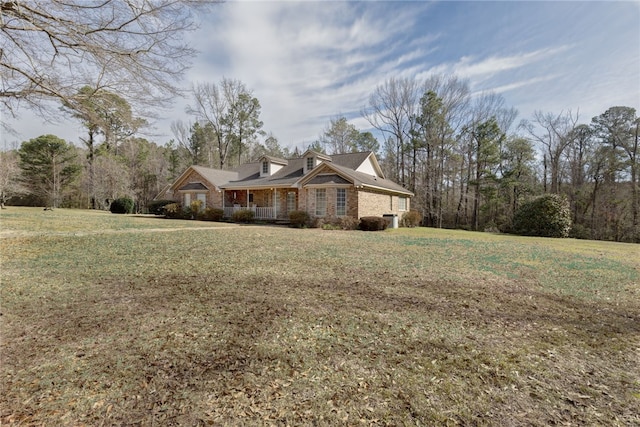 view of side of property with a yard