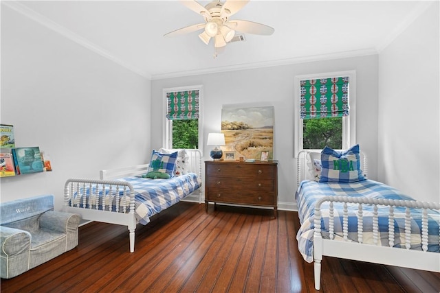 bedroom featuring baseboards, a ceiling fan, hardwood / wood-style flooring, and crown molding