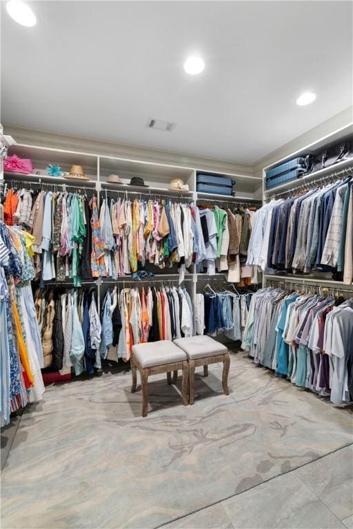 spacious closet featuring visible vents