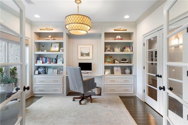 office space featuring dark wood-type flooring, french doors, crown molding, and built in features