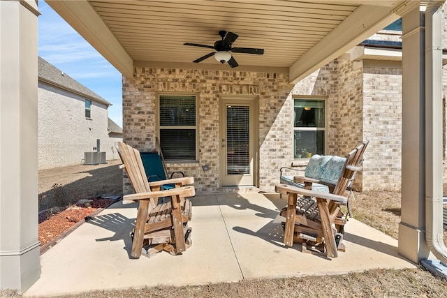 view of patio featuring central AC unit and a ceiling fan