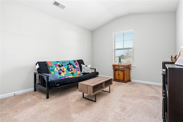 living area featuring carpet, visible vents, vaulted ceiling, and baseboards