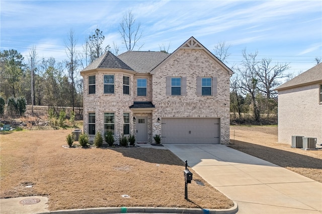 view of front facade with an attached garage, roof with shingles, concrete driveway, and brick siding