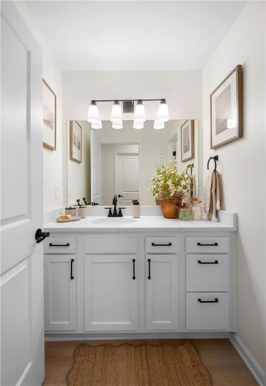 bathroom featuring vanity and wood finished floors