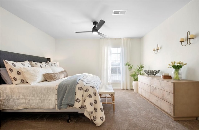 bedroom featuring carpet, visible vents, and a ceiling fan