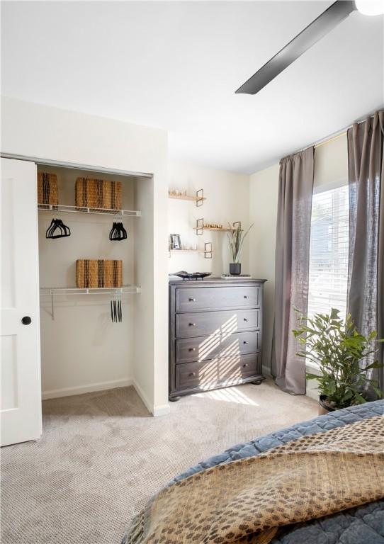 carpeted bedroom with baseboards